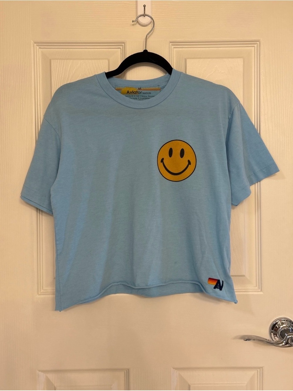 Aviator Nation Women’s Light Blue Smiley Face Cropped Tee